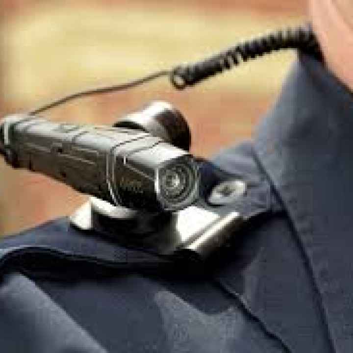 Body camera rests on top of officer's shoulder